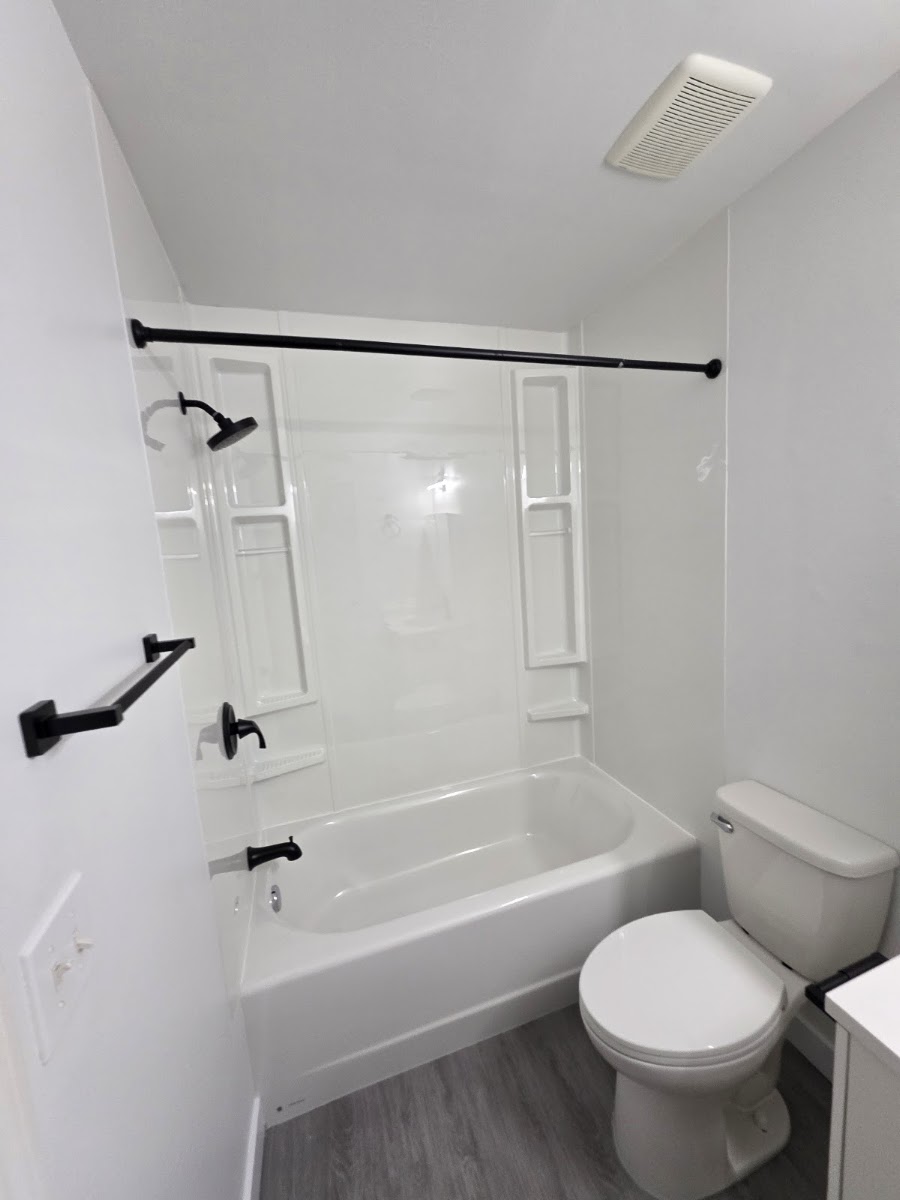 New vanity installation with plumbing rough-in and drywall finishing